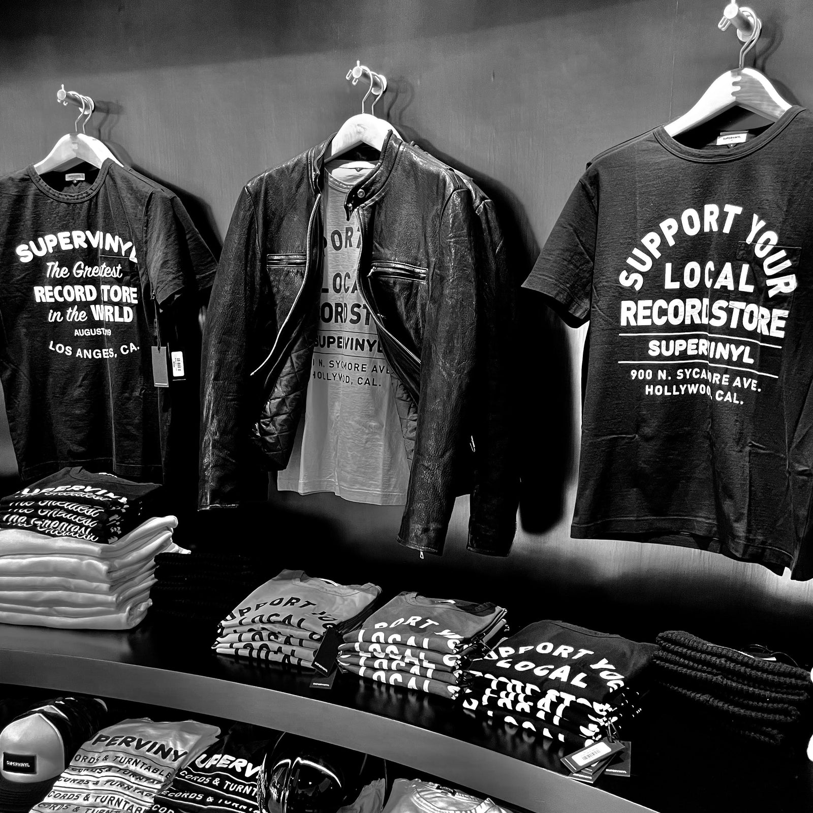 Supervinyl’s existing graphic tees and leather jacket display